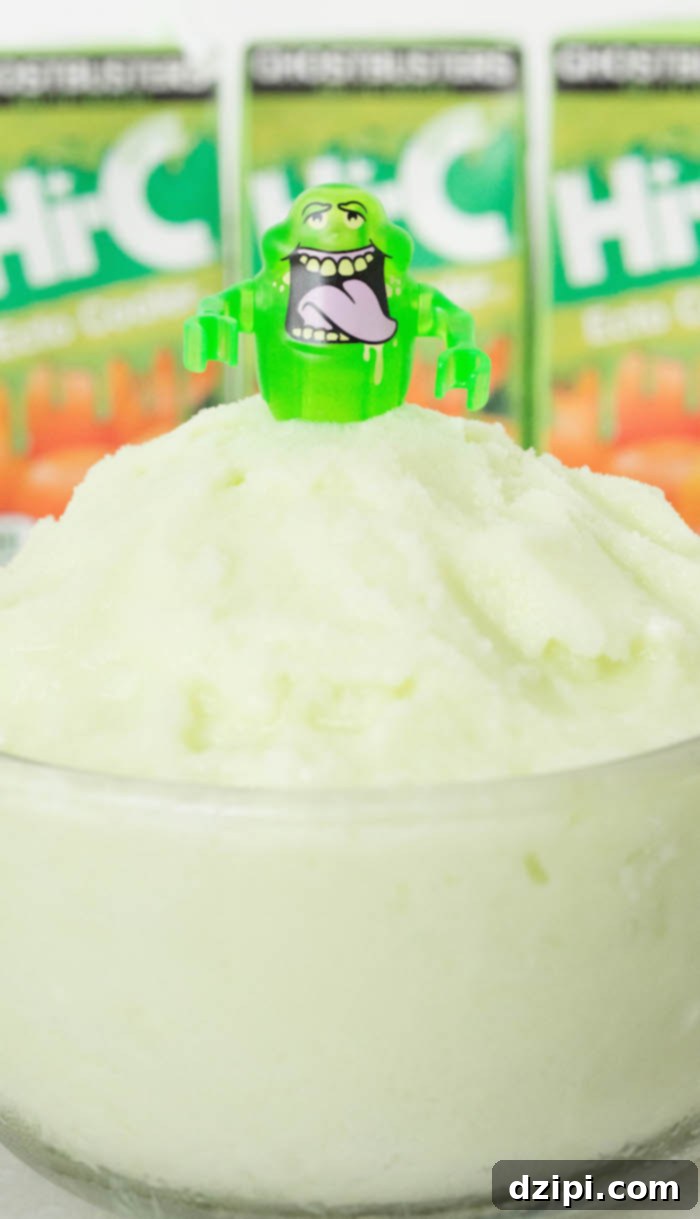 A close-up view of a bowl filled with light green Ecto Cooler sherbet, showcasing its smooth and creamy texture.