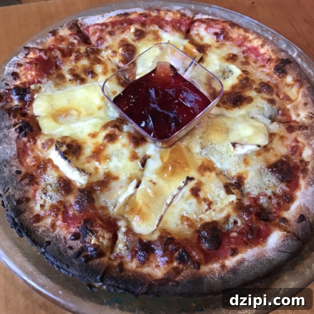 Unique Settler's Pizza with four Icelandic cheeses and red currant jam at Halldorskaffi in Vik.