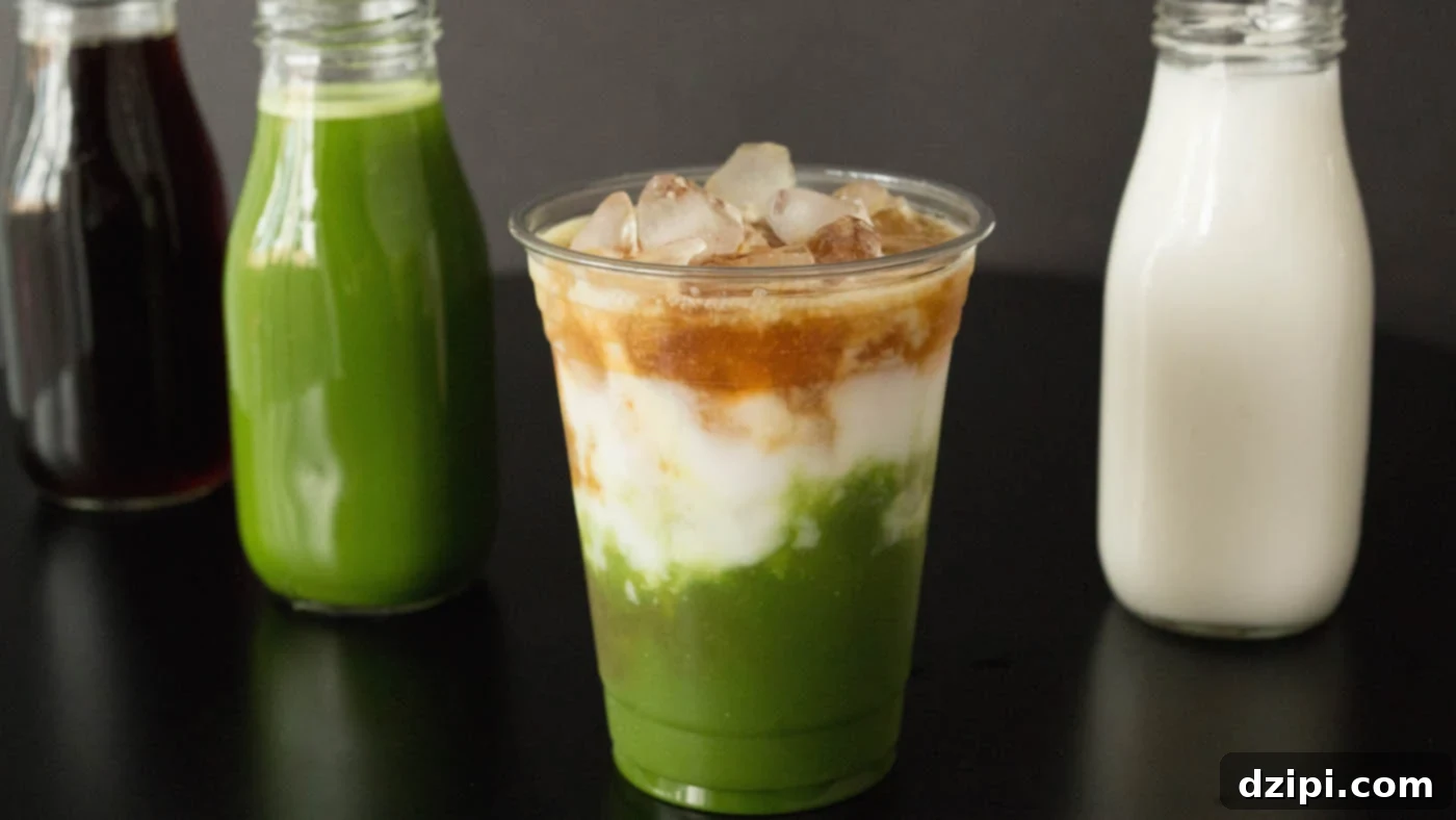 Starbucks Copycat Matcha Espresso Fusion Latte in front of bottles of coffee, matcha, and milk.