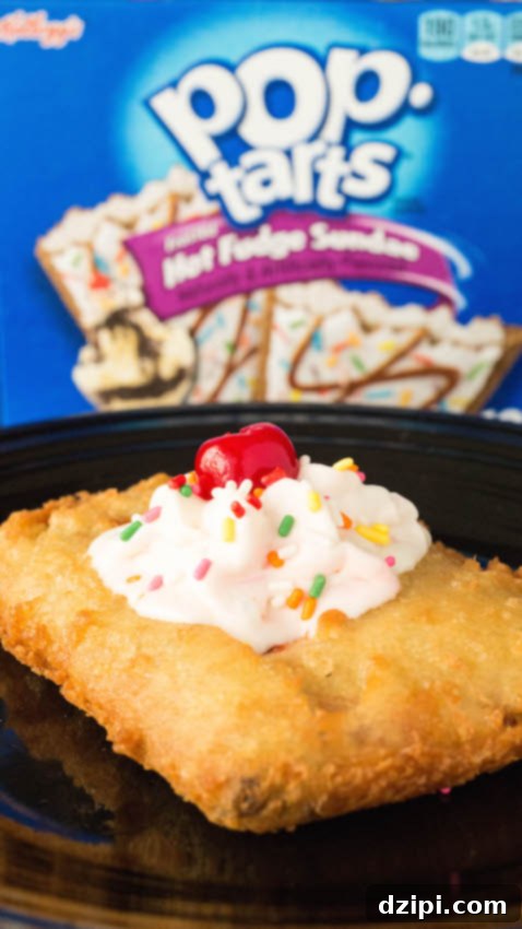 Ultimate Deep Fried Pop-Tarts 3 Close up of a homemade deep fried pop-tart that has been topped with whipped cream, sprinkles, and a cherry.