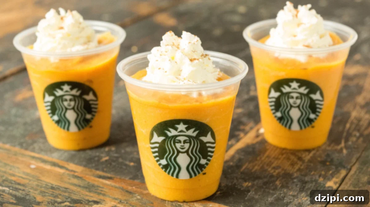 Three mini Starbucks cups filled with dog-friendly pumpkin spice lattes, perfect for autumn treats.