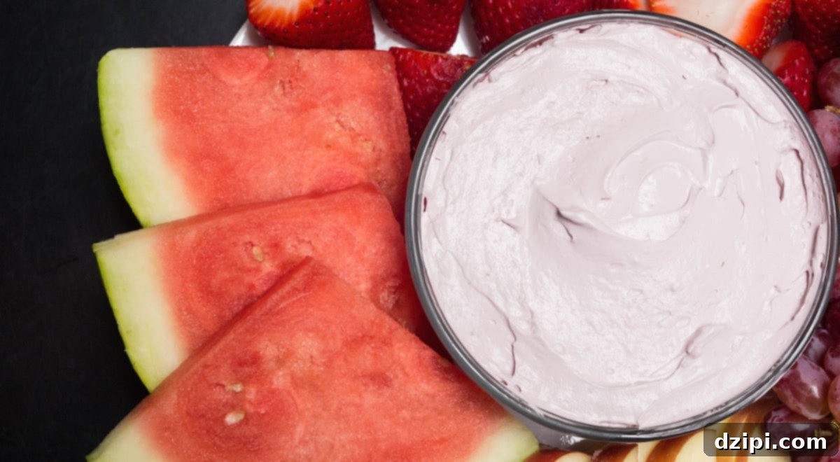 Sliced watermelon next to a bowl of Red Wine Fruit Dip, hinting at a delightful dessert.