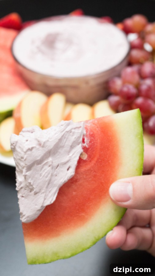 A refreshing slice of watermelon, freshly dipped in the luscious red wine fruit dip.