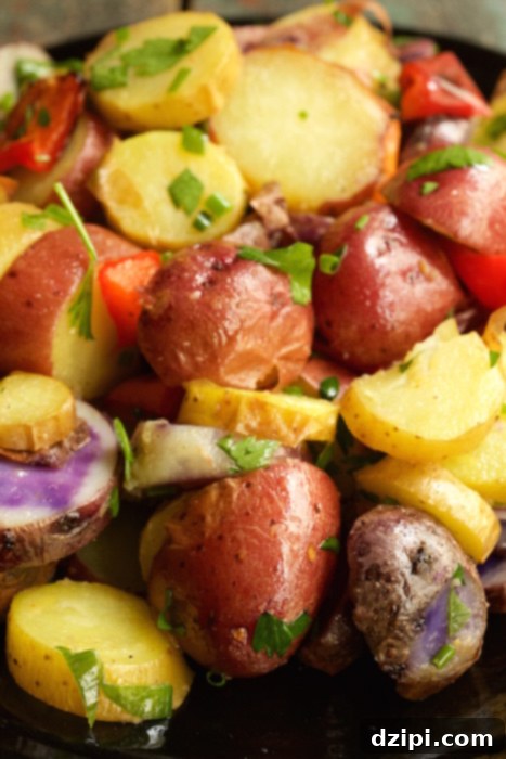 A close-up shot of the stunning 4th of July potato salad, showcasing a colorful mix of red, yellow, and purple potatoes.