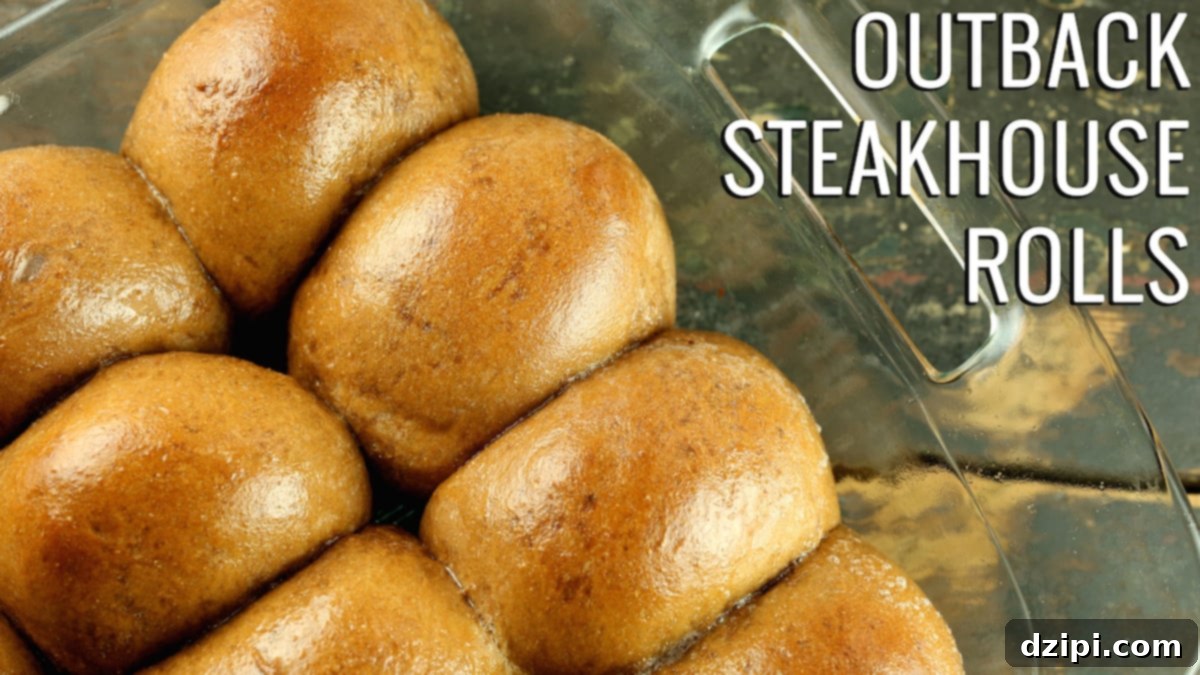 Close up of brown rolls in a glass casserole dish. Text reads 'Outback Steakhouse Rolls'