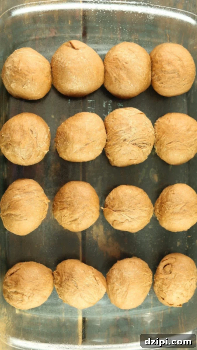 Outback steakhouse rolls proofing in a glass casserole dish.