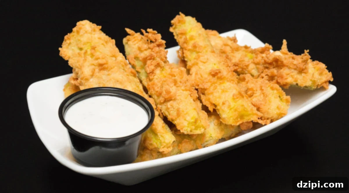 Crispy Chicken Fried Pickles next to ranch dipping sauce.
