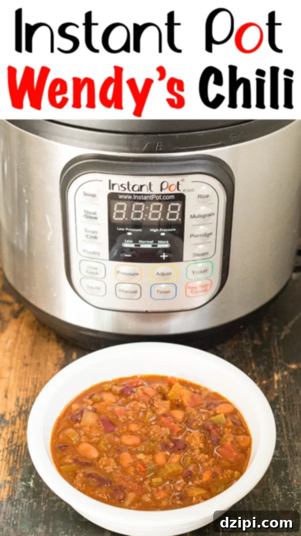 Instant Pot Copycat Wendys Chili 3 A vibrant bowl of Instant Pot Wendy's Chili, garnished and ready to eat, positioned prominently in front of a shiny Instant Pot appliance. The image clearly features the text 'Instant Pot Wendy's Chili'.