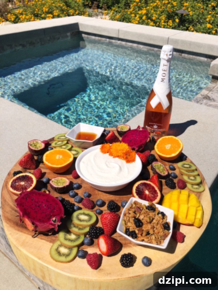 Coachella Eats and Sips 19 Coachella Food To Bring - Fruit & Yogurt Brunch Board with Champagne: The Perfect Hydrating Breakfast