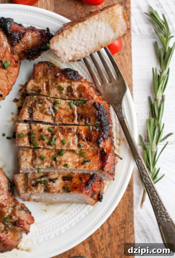 Sun-Kissed Grill Feasts 5 Grilled Dijon Rosemary Pork Chops - Flavorful and tender grilled pork ideal for summer