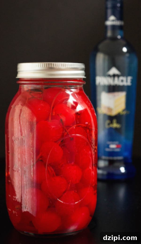 Confetti Cherry Bombs 4 A mason jar of maraschino cherries stacking in cake vodka.