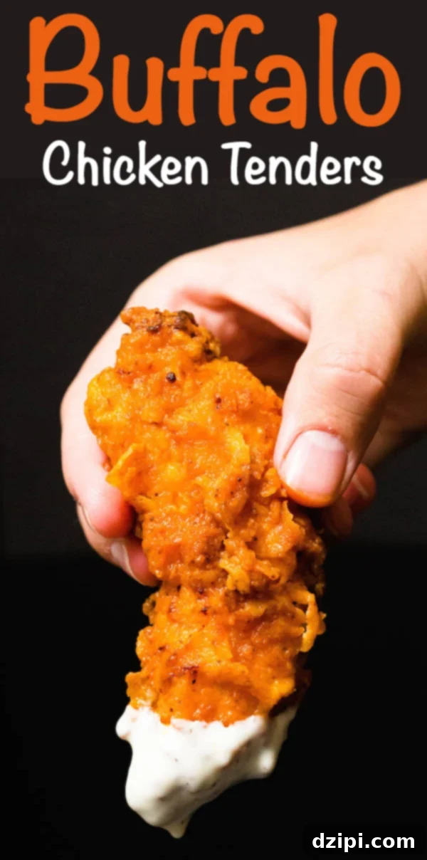 A hand holds up an orange chicken tender generously coated in buffalo sauce and freshly dipped in creamy ranch. The image features a bold text overlay that reads "Buffalo Chicken Tenders".