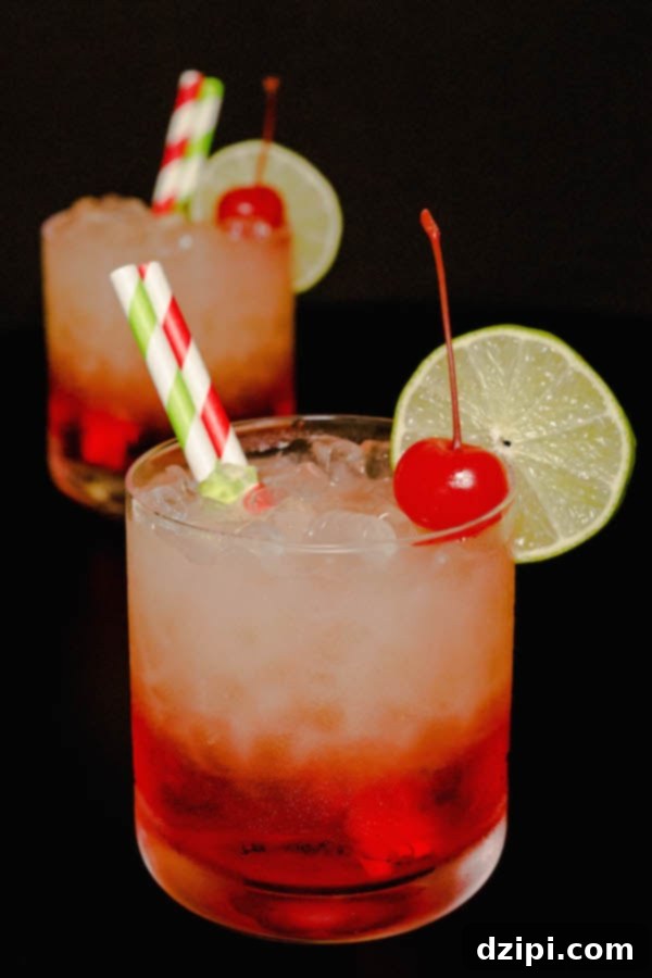 Zesty Cherry Limeade Refresher 4 Two layered Cherry Limeade Vodka Drinks on a sleek black background, garnished with limes and cherries.
