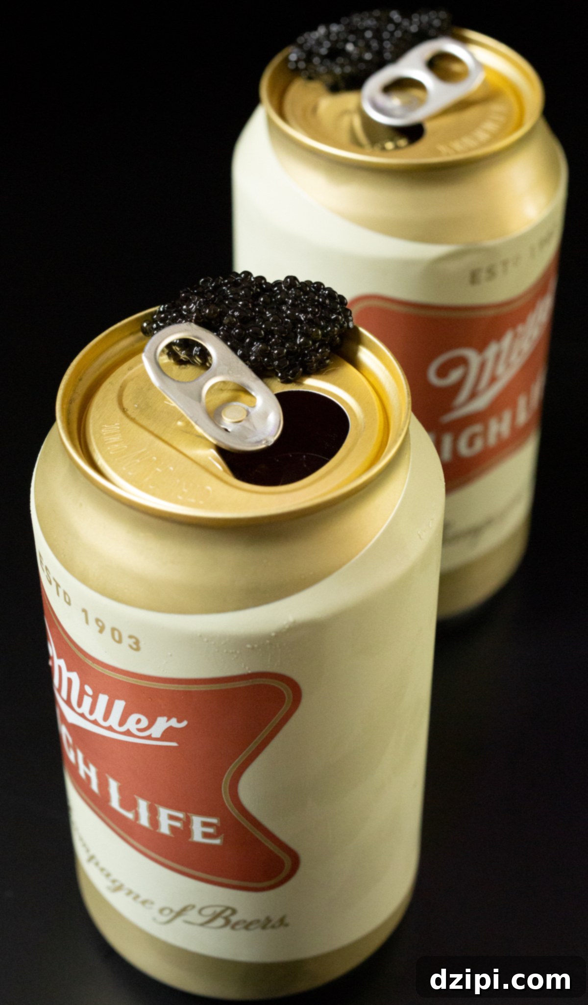 Serving Caviar: A Connoisseur's Guide 8 Two cans of Miller High Life, each with a generous bump of caviar on the rim.